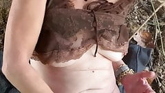 Sexy mature masturbates outside
